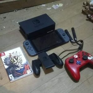 A Nintendo switch with dragon Ball z and a control